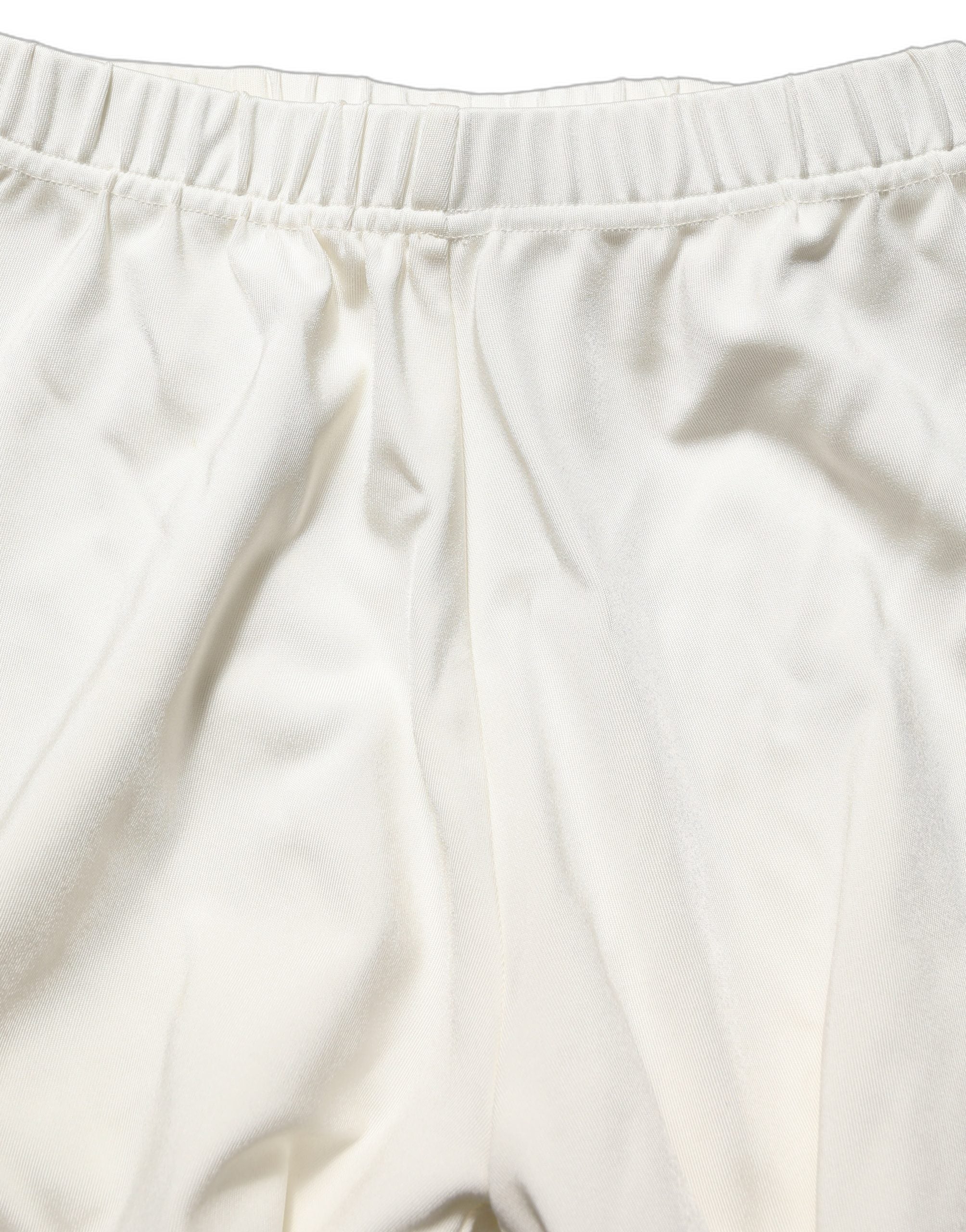 Chaussures à talons hauts blanches Dolce & Gabbana, pumps en jersey avec collants assortis, élégantes et sophistiquées.