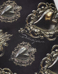 Sweat-shirt en coton noir Dolce & Gabbana avec motif cœur sacré, manches longues et design élégant.