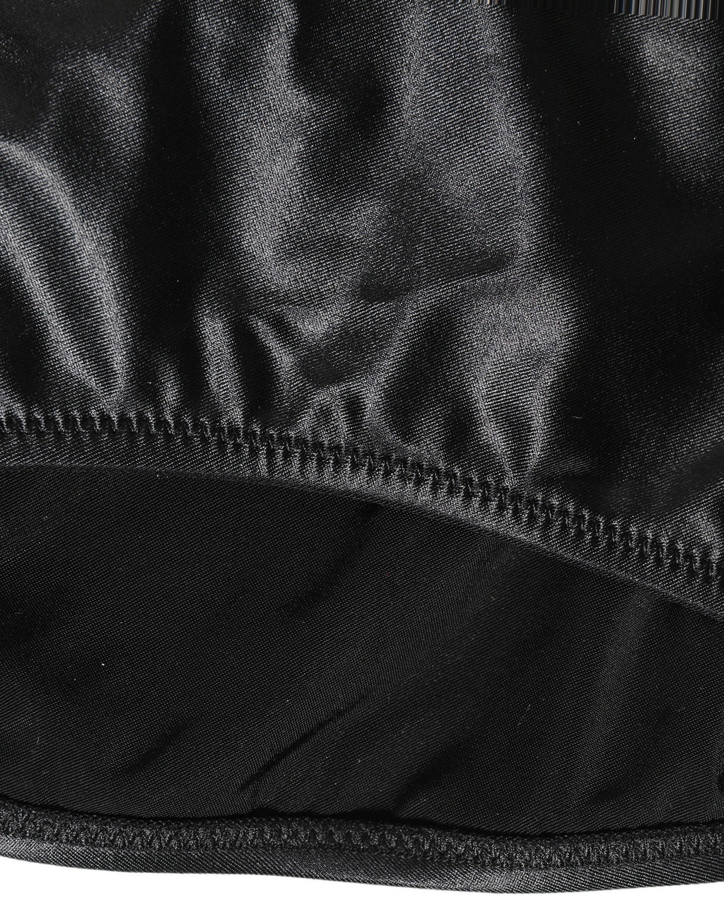 Maillot de bain une pièce noir Dolce & Gabbana avec décolleté en V profond et découpes élégantes, parfait pour la plage.