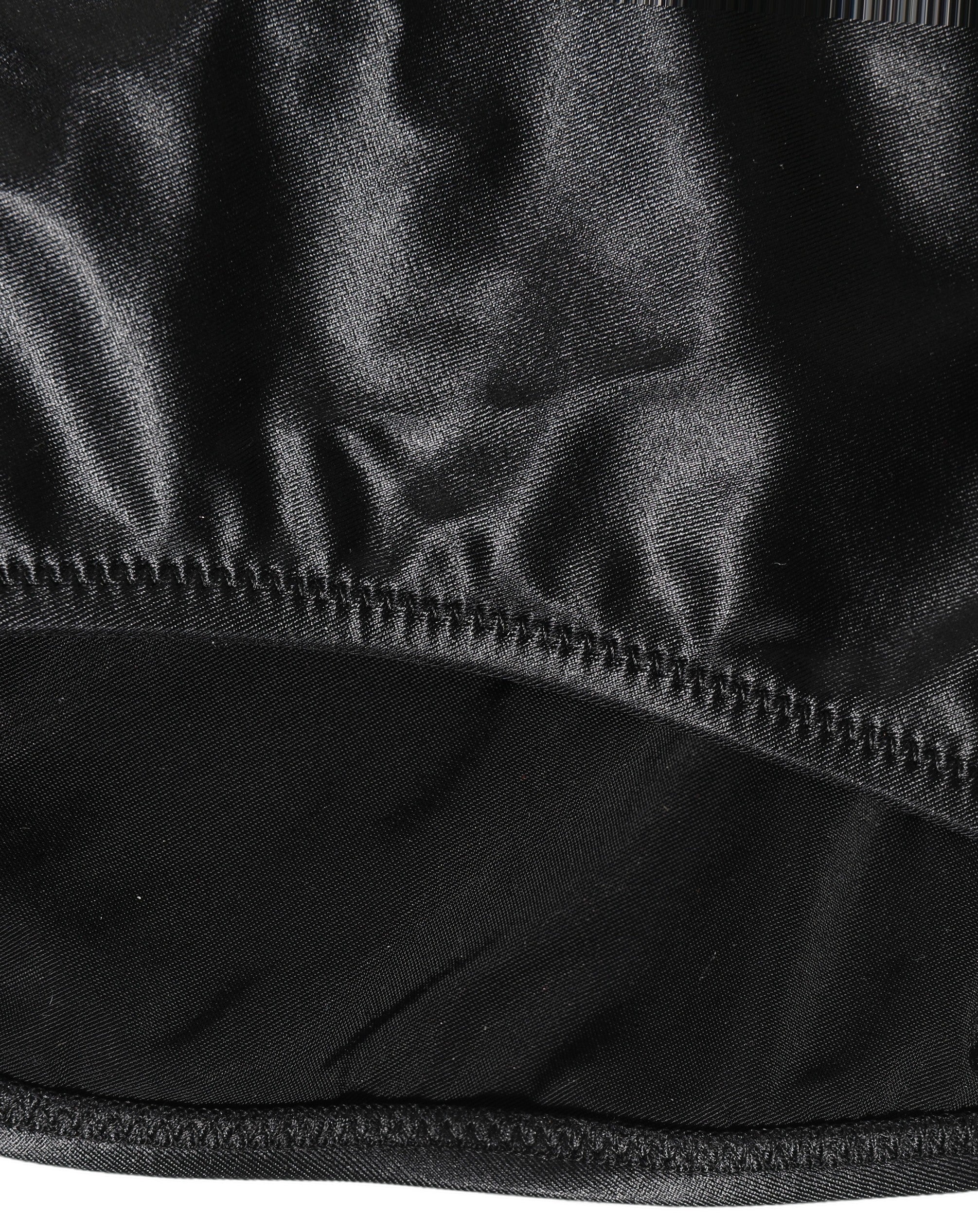 Maillot de bain une pièce noir Dolce & Gabbana avec décolleté en V profond et découpes élégantes, parfait pour la plage.