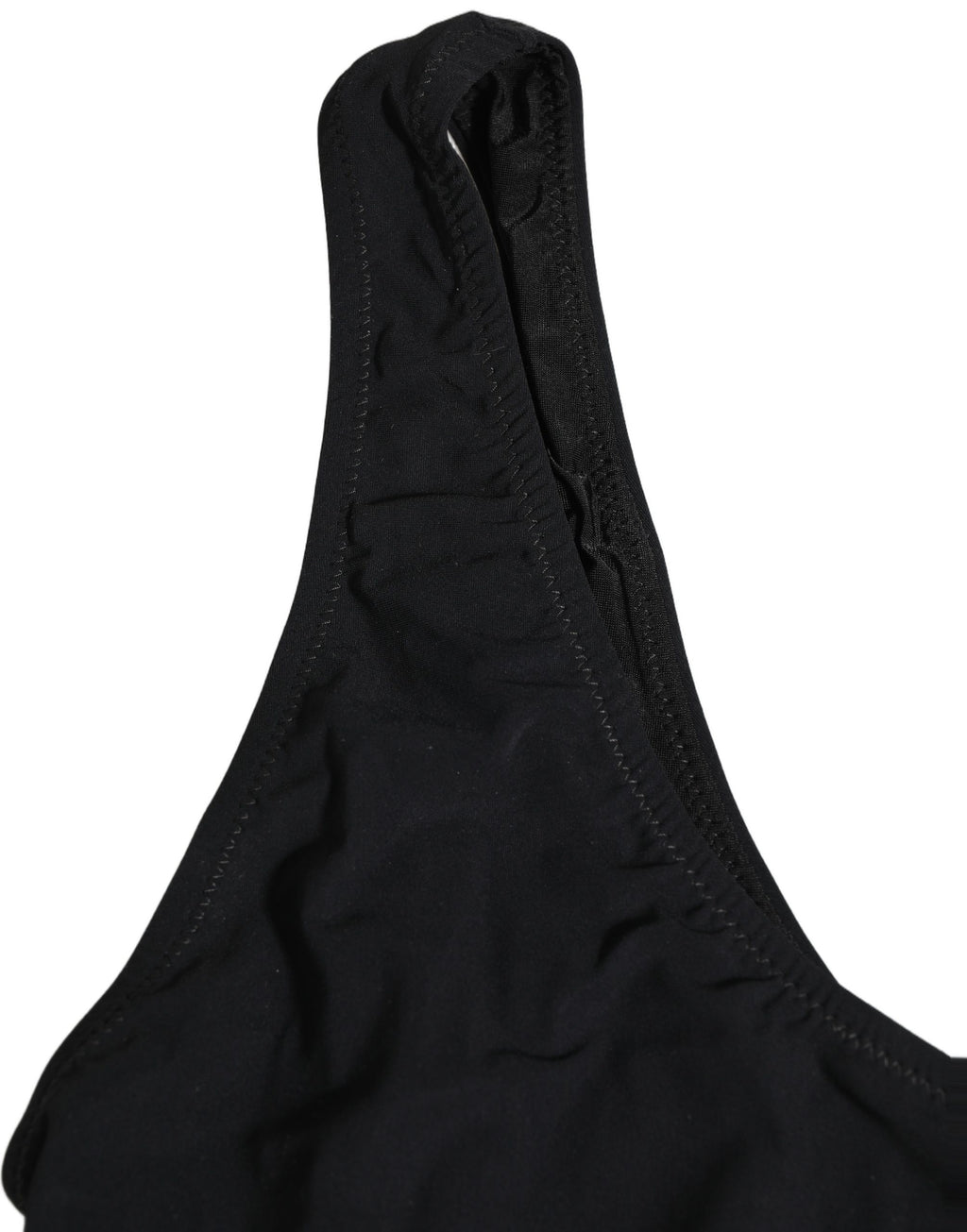Maillot de bain une pièce noir Dolce & Gabbana avec logo découpé, design élégant et moderne, vu en détail.