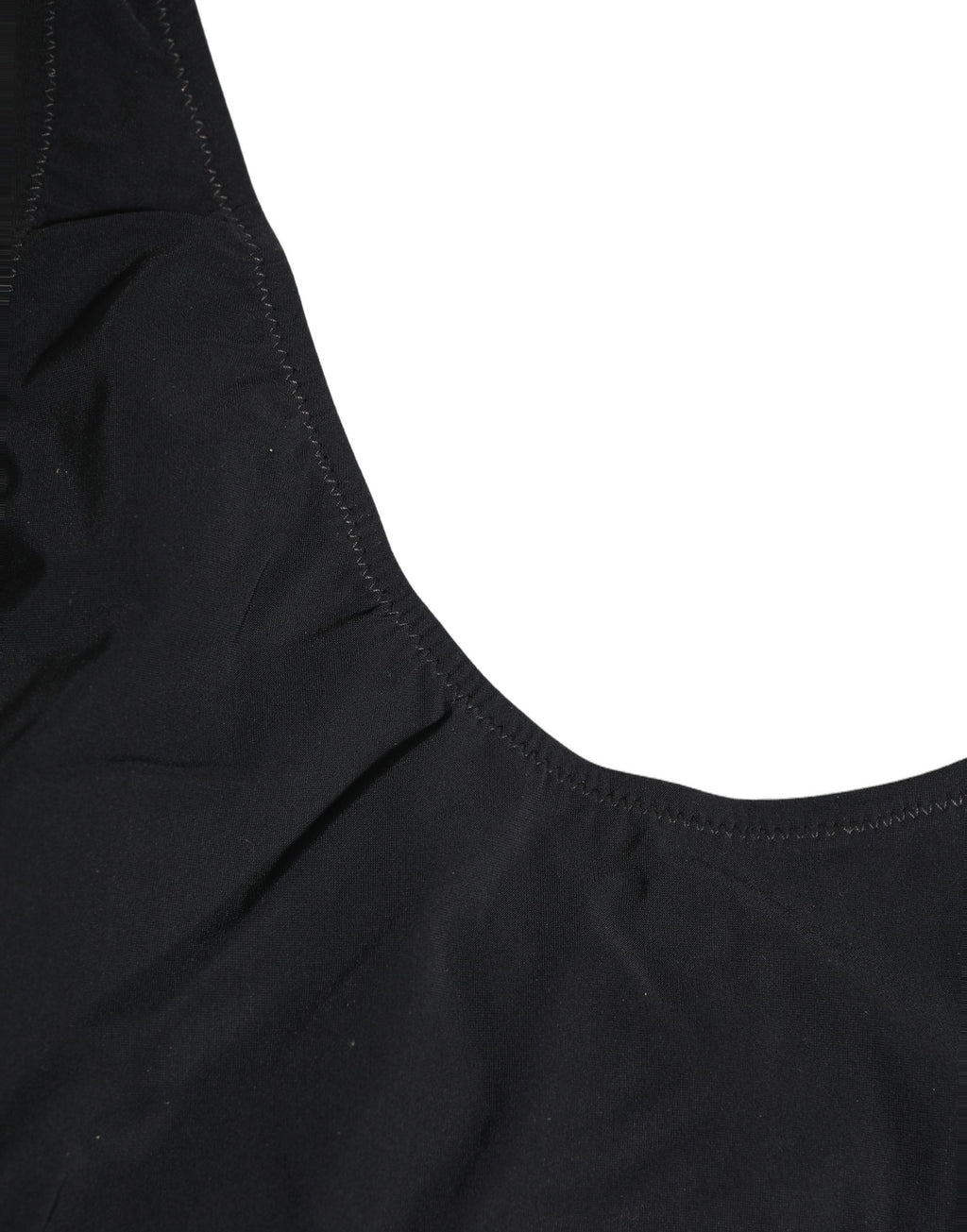 Maillot de bain une pièce noir Dolce & Gabbana avec logo découpé et design élégant, visible en détail dans l'image.