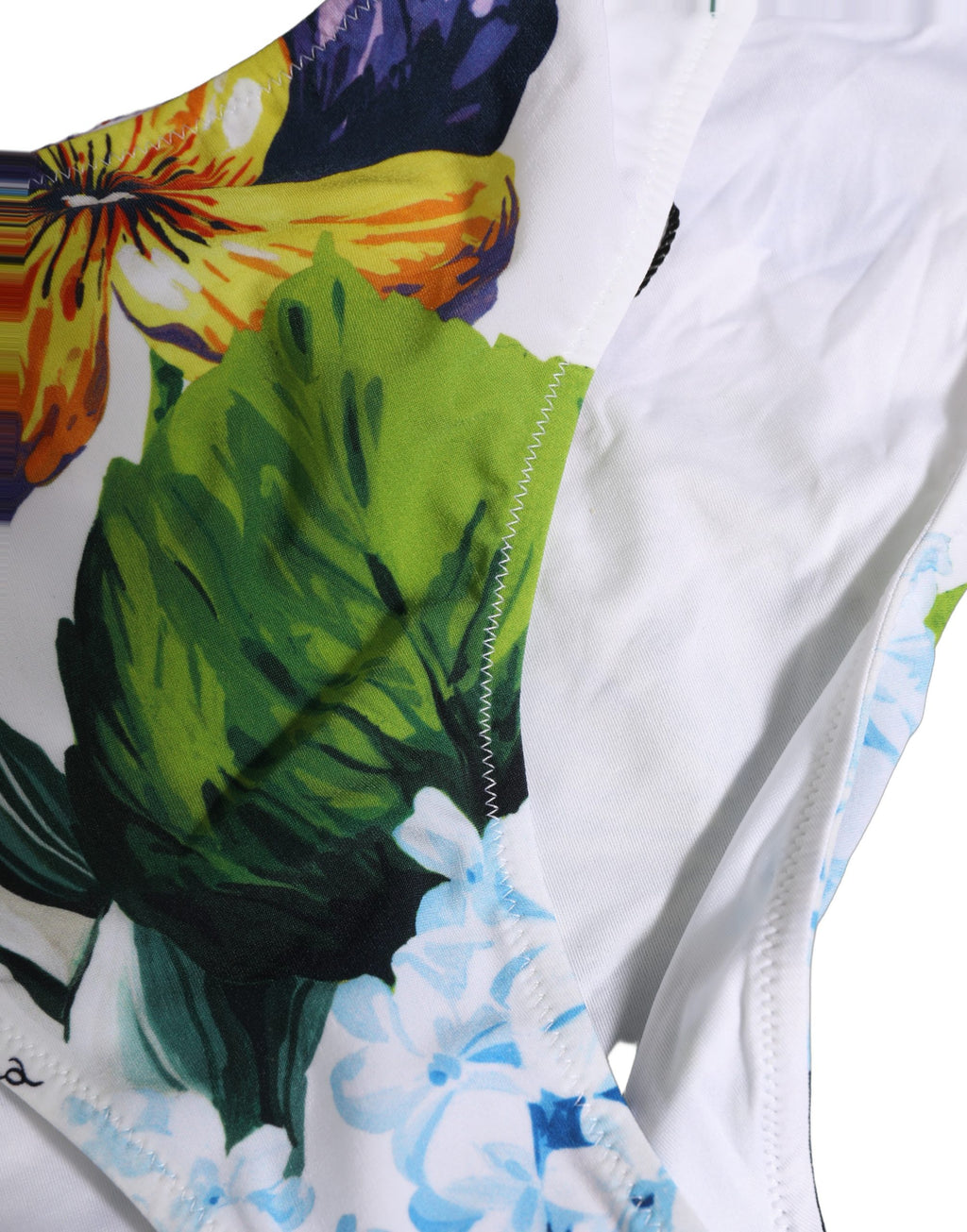 Maillot de bain deux pièces Dolce & Gabbana, tanga floral blanc, haut bandeau élégant pour la plage.