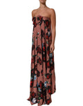 Robe longue bustier en soie rose poussière avec motif floral, de la marque Dolce & Gabbana, visible en détail.