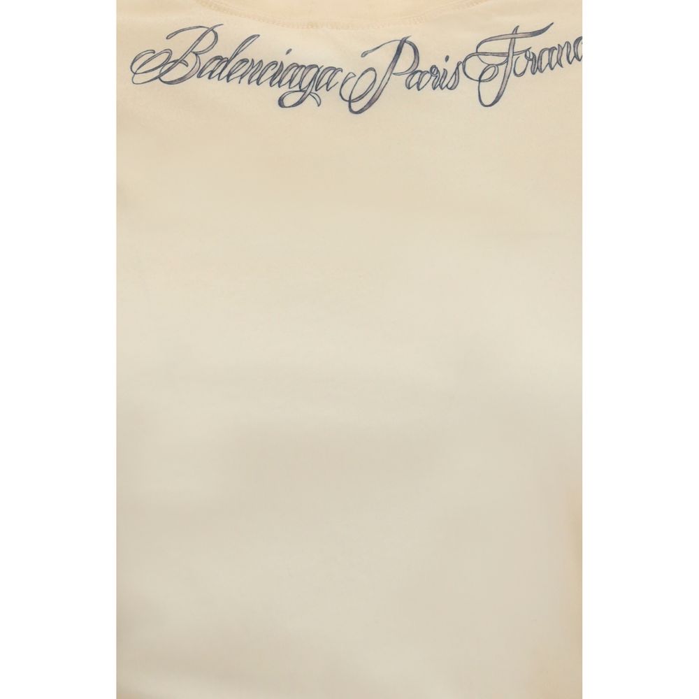 T-shirt beige en coton de la marque Balenciaga, coupe classique, porté sur un mannequin.