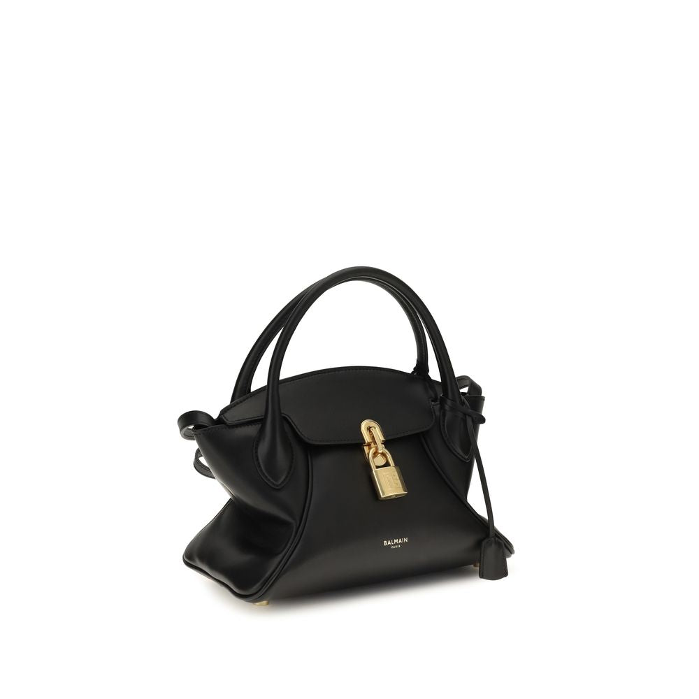 Sac à main Balmain en cuir de veau noir Bos Taurus, design élégant avec détails modernes et finition raffinée.