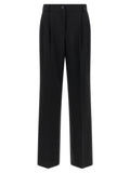 Pantalons décontractés en laine vierge noire de Dolce & Gabbana, style élégant et confortable, visibles sur l'image.
