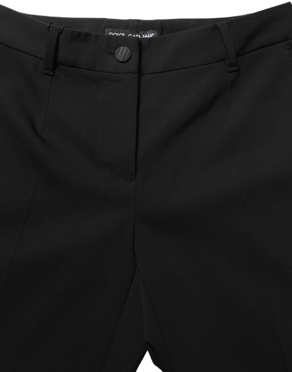 Pantalon Dolce & Gabbana noir à taille haute et coupe droite, en tissu élégant, porté comme pantalon de costume ou de soirée.
