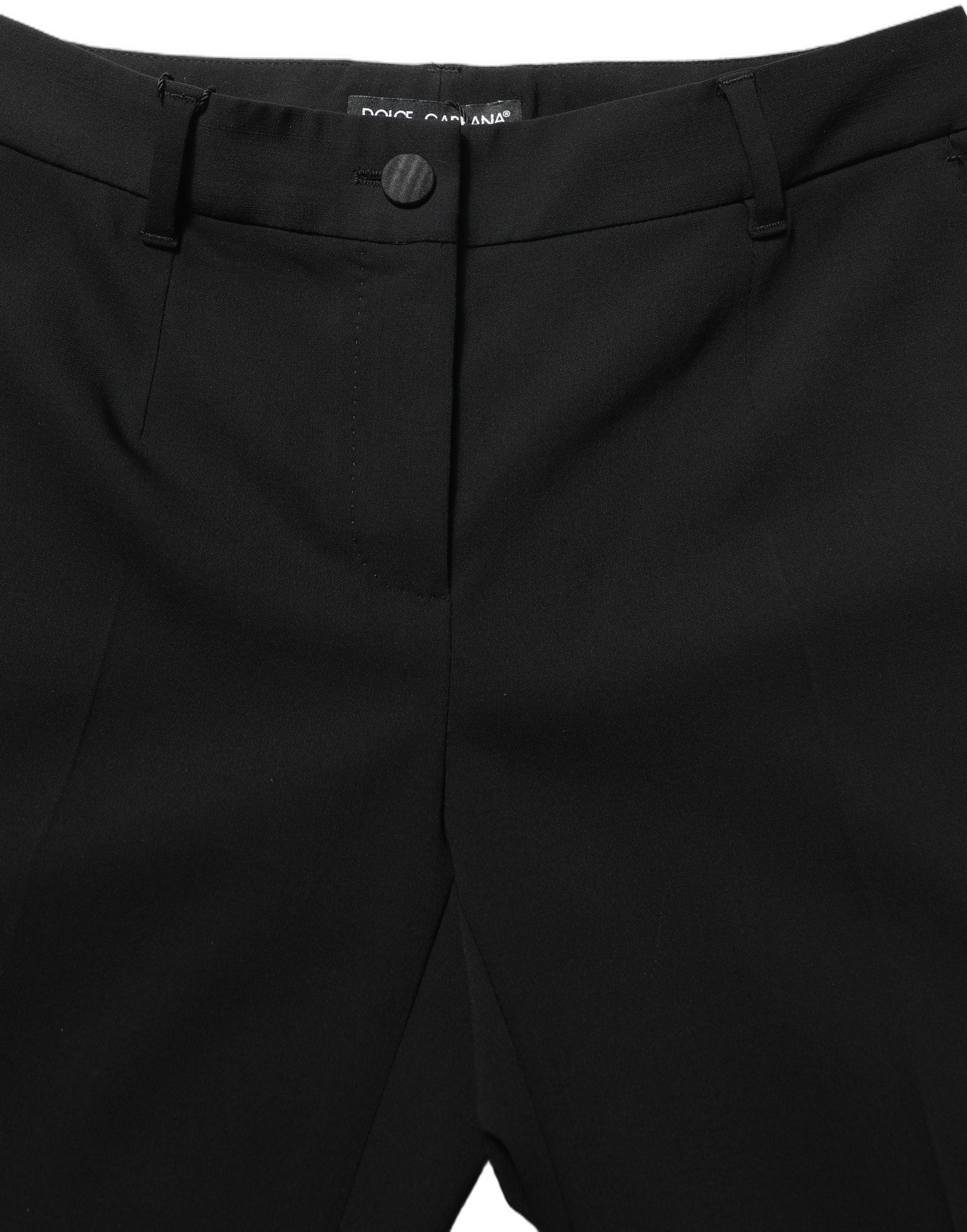Pantalon Dolce & Gabbana noir à taille haute et coupe droite, en tissu élégant, porté comme pantalon de costume ou de soirée.