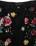 Pantalon en coton noir à fleurs Dolce & Gabbana, taille haute, coupe tapered, mode élégante et confortable.