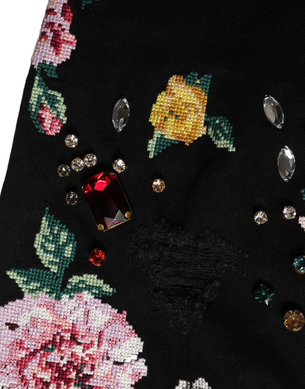 Pantalon noir à fleurs en coton Dolce & Gabbana, taille haute, coupe tapered, tissu léger et élégant.