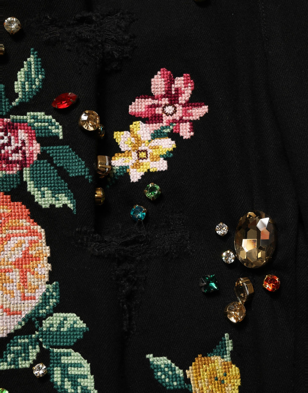 Pantalons en coton noir à fleurs Dolce & Gabbana, taille haute et coupe tapered, visible avec motif floral élégant.