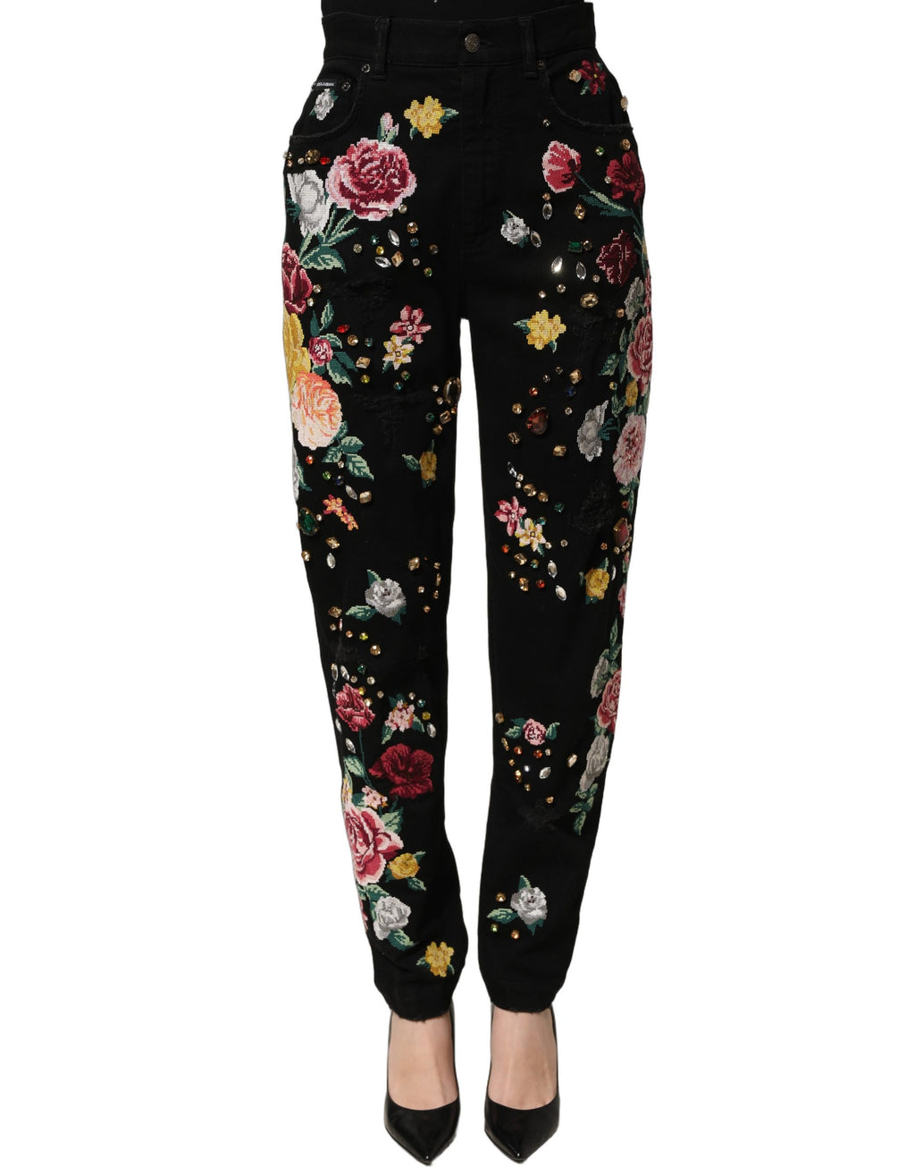 Pantalons Dolce & Gabbana en coton noir à fleurs, taille haute, coupe tapered, portée avec un style élégant et féminin.