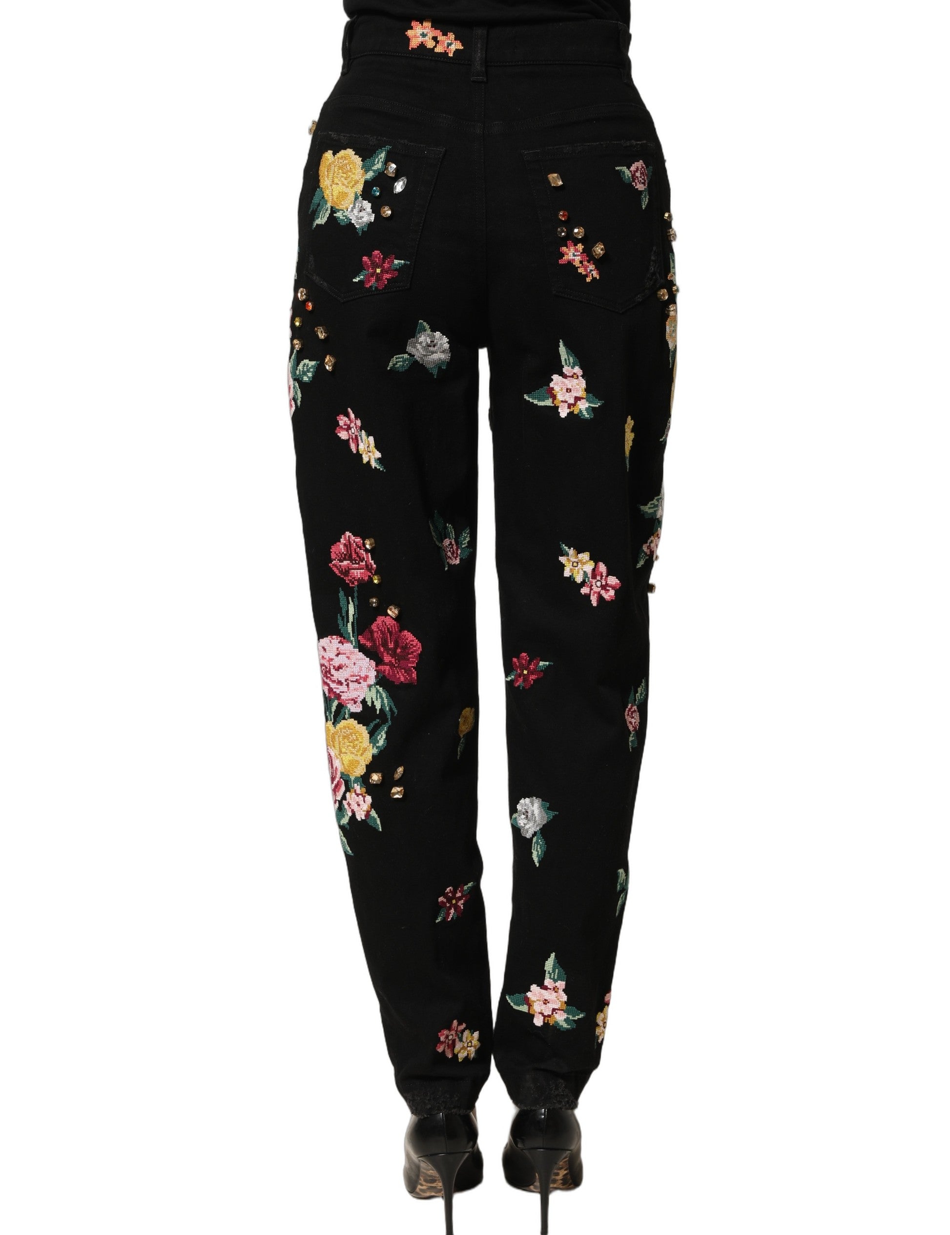 Pantalons noirs en coton à fleurs Dolce & Gabbana, taille haute et coupe tapered, visibles sur l'image.