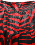 Pantalon en coton à taille haute Dolce & Gabbana avec motif zèbre rouge et noir, style élégant et moderne.