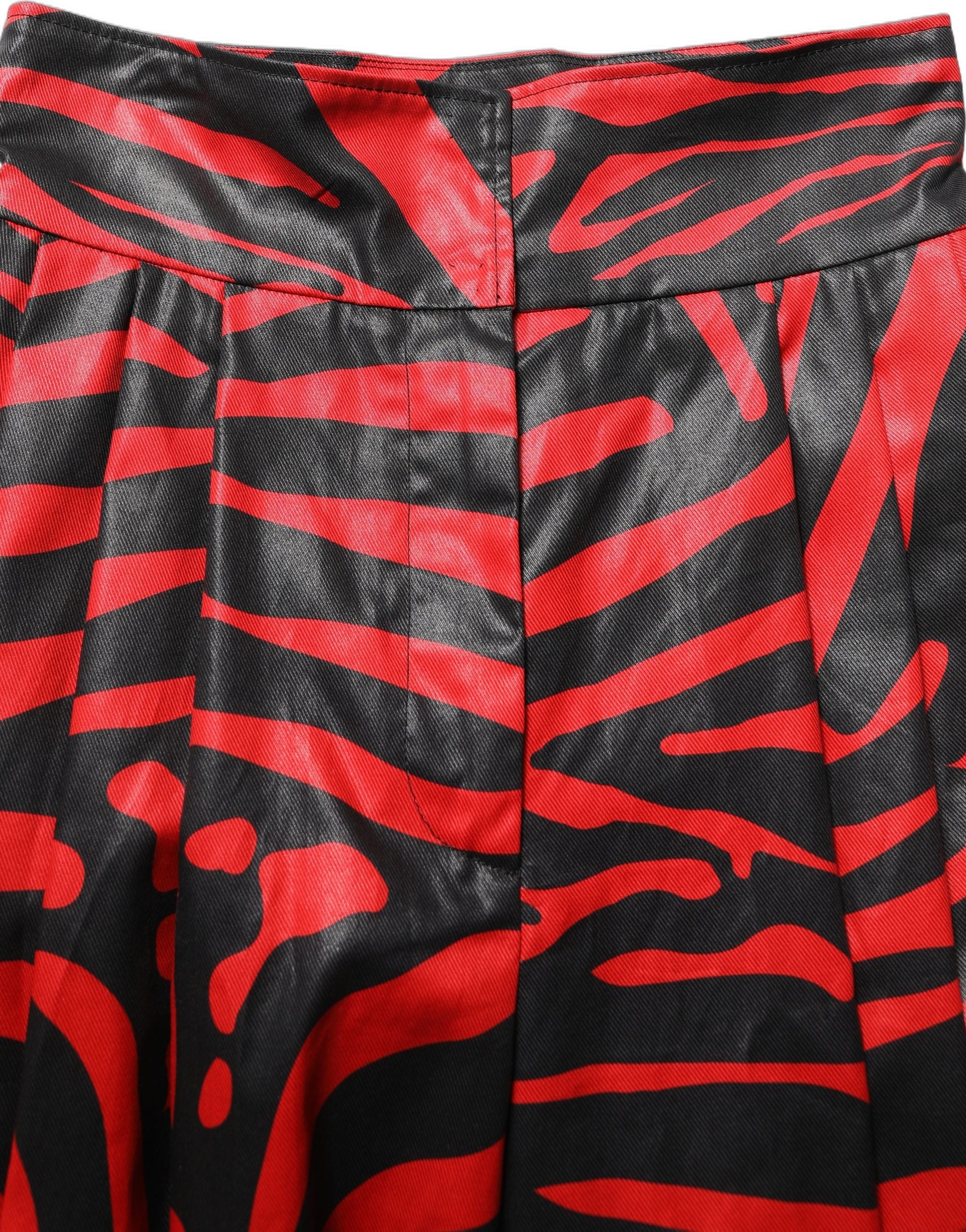 Pantalon en coton à taille haute Dolce & Gabbana avec motif zèbre rouge et noir, style élégant et moderne.