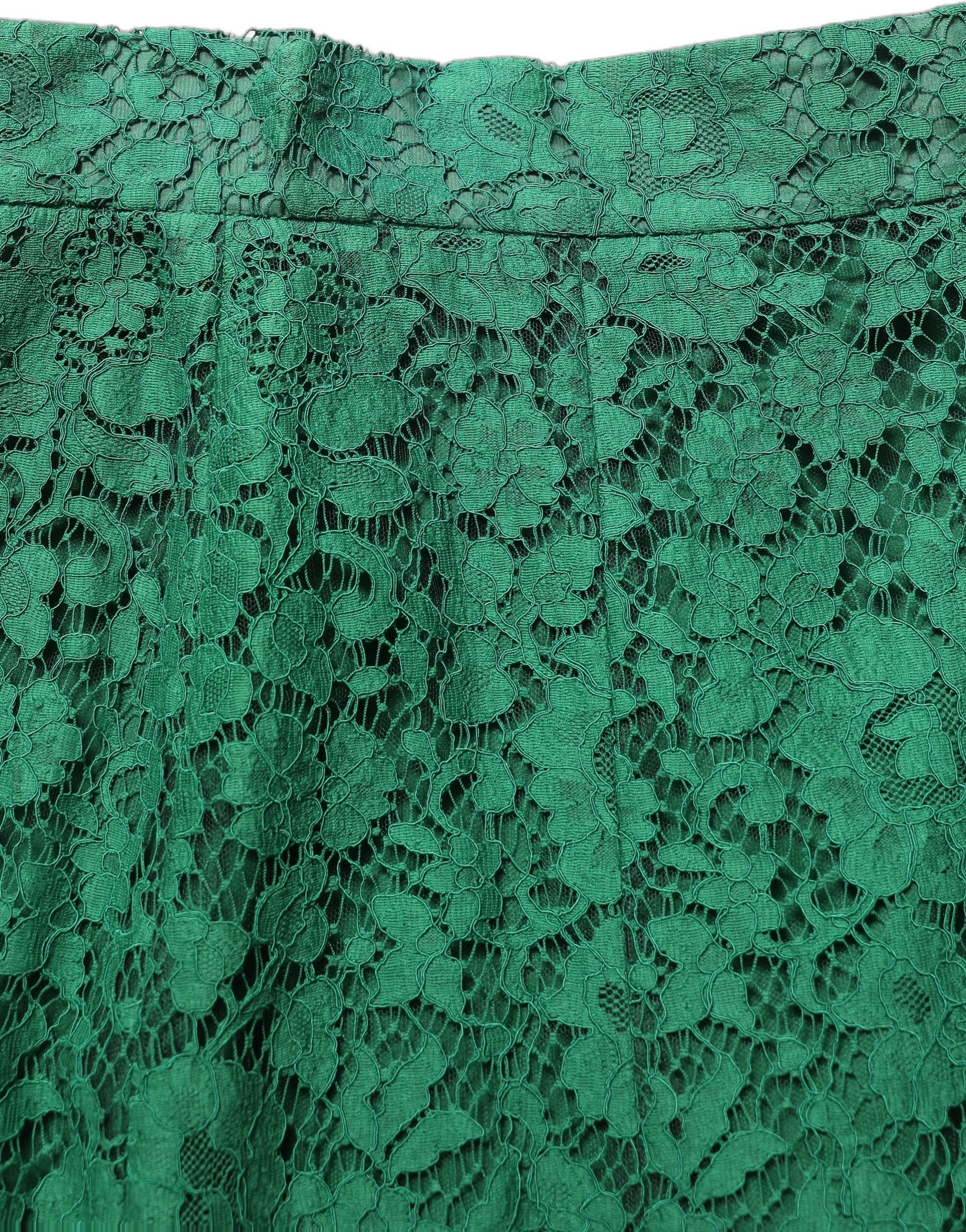 Jupe midi sirène en dentelle verte de haute taille de Dolce & Gabbana, détails élégants et finition raffinée visible sur l'image.