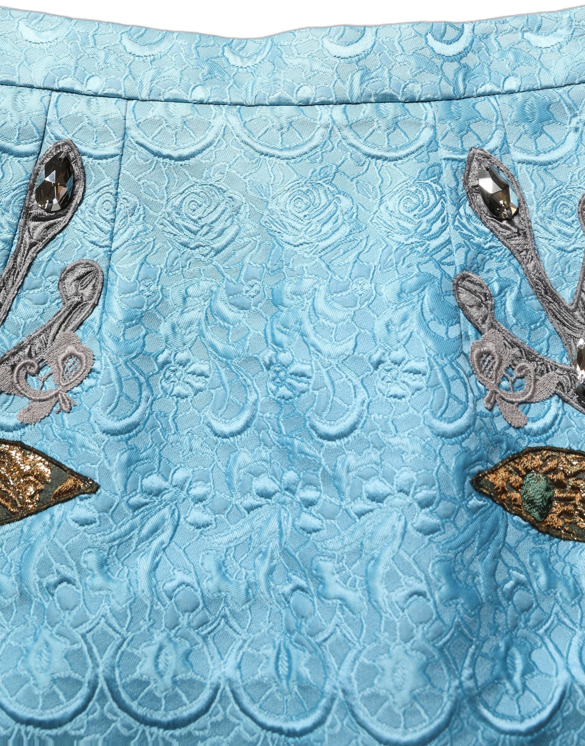 Jupon midi en jacquard bleu avec broderies, marque Dolce & Gabbana, coupe A-line, tissu élégant et sophistiqué.