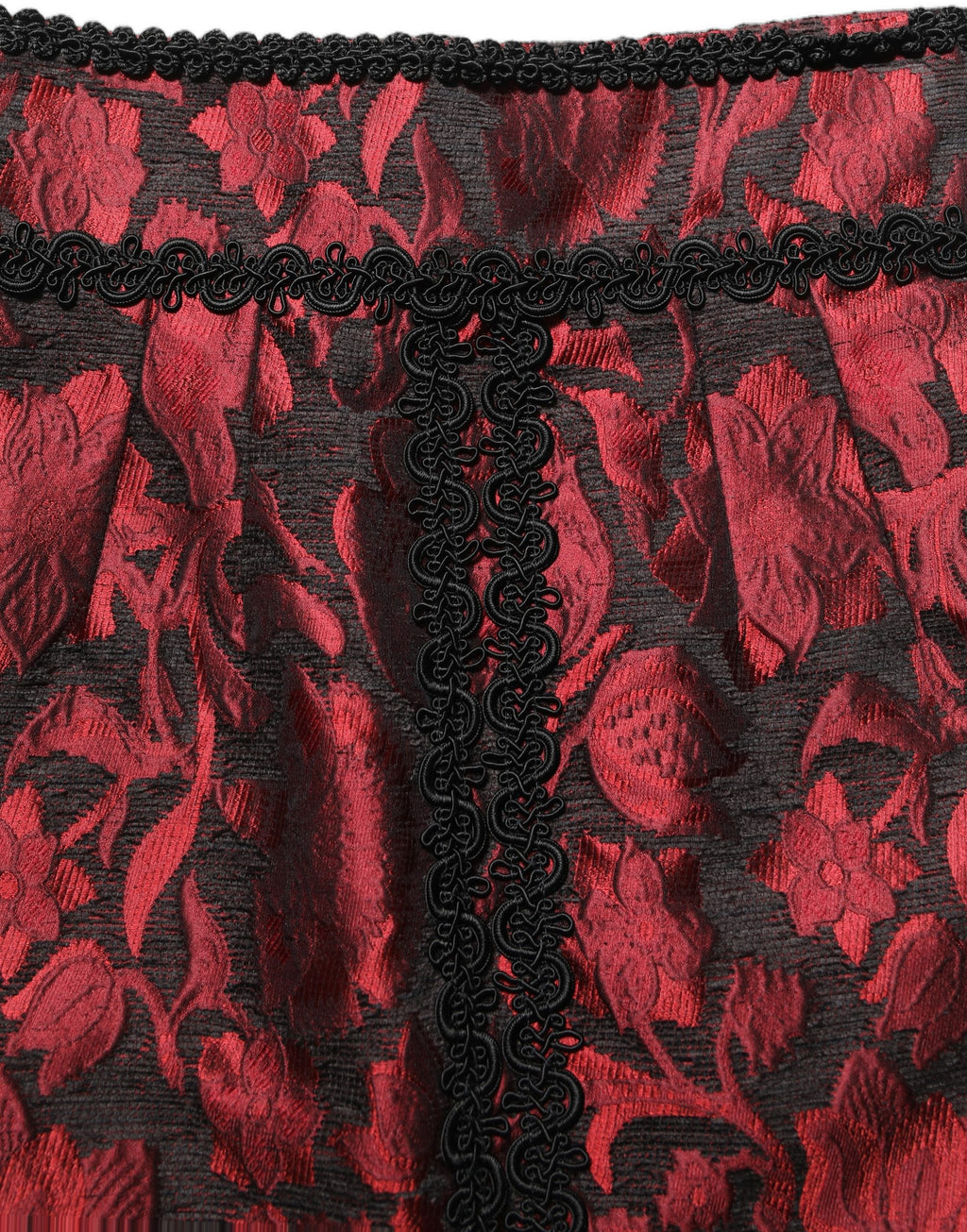 Jupe courte en jacquard floral rouge et noir de Dolce & Gabbana, mettant en valeur un motif en dentelle élégante.