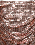 jupe longue Dolce & Gabbana en sequins roses or, taille haute et froncée, vue de face sur fond blanc