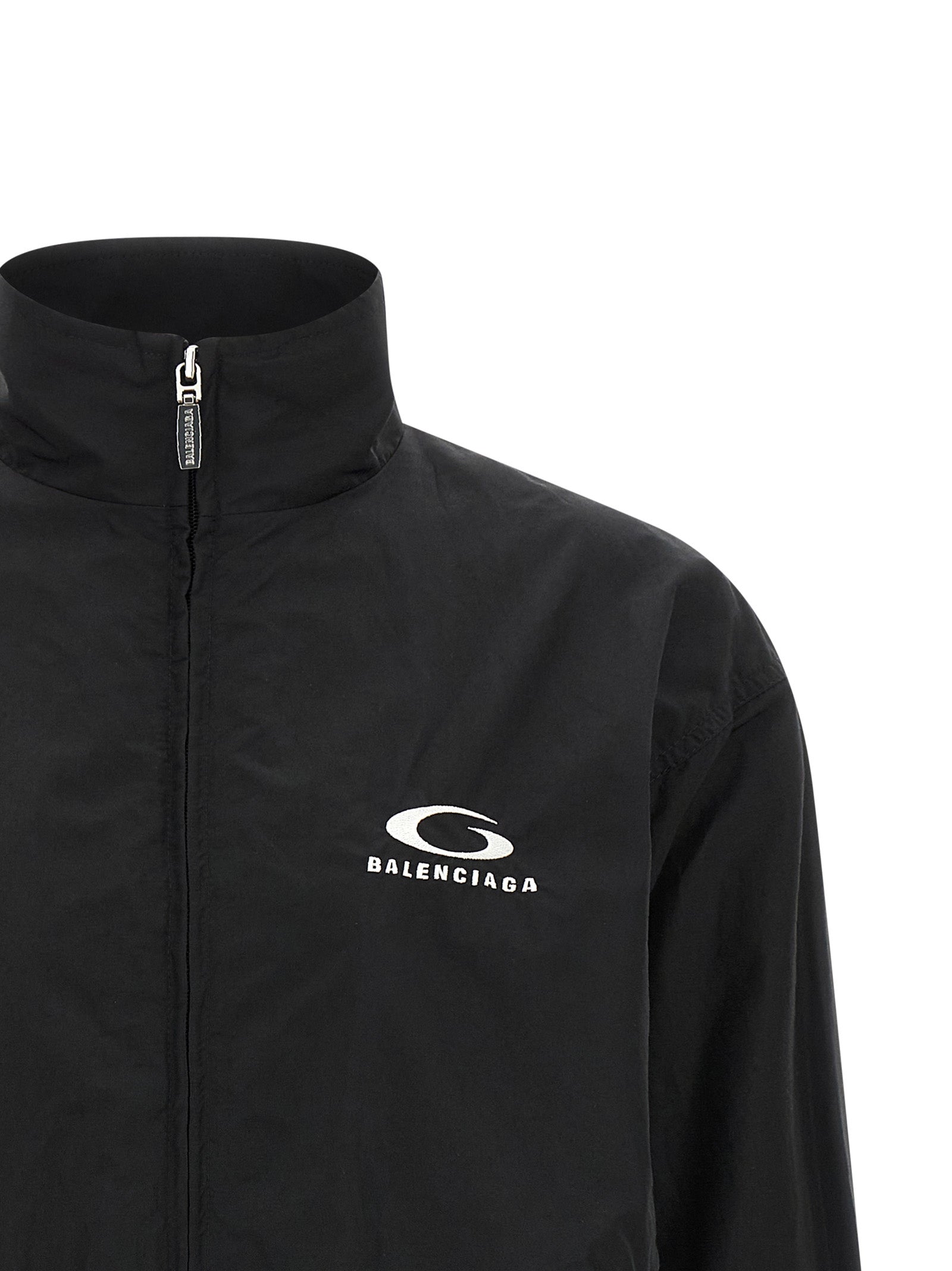 Veste bomber noire en coton de Balenciaga, coupe ajustée avec détails modernes, vue de face sur un fond neutre.
