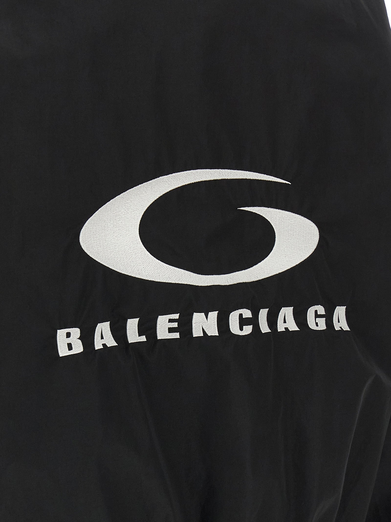 Veste bomber noire en coton de la marque Balenciaga, fermeture éclair, style décontracté, vue de face.