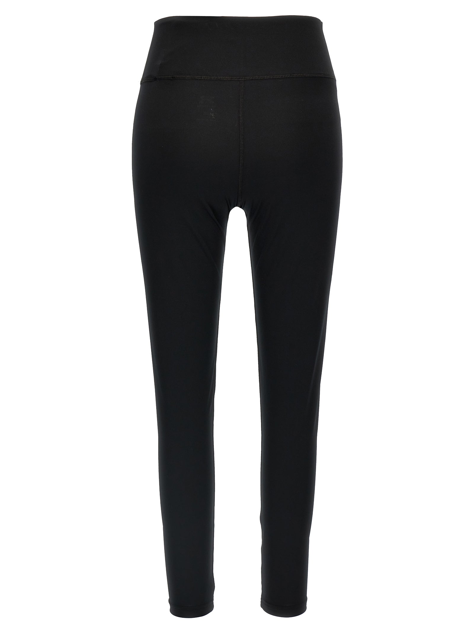 Leggings en polyester noir de la marque Balenciaga, tissu extensible et ajusté, porté comme vêtement de mode moderne.