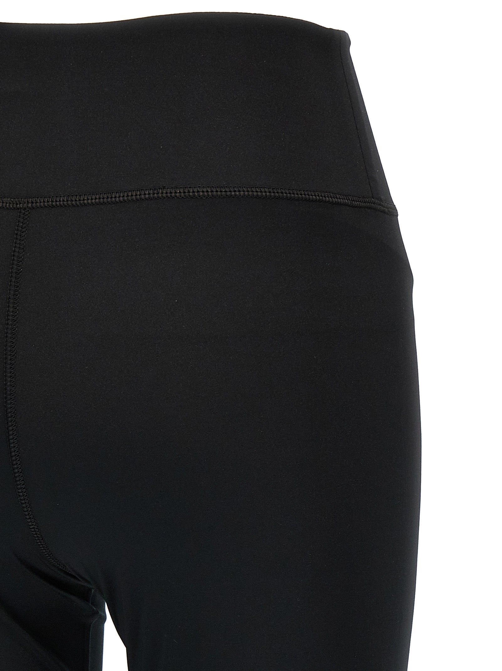 Leggings en polyester noir de la marque Balenciaga, ajustés et élégants, visibles sur l'image.