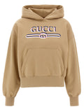 Sweat à capuche en coton beige Gucci avec logo Gucci visible, douceur et style pour un look décontracté et luxueux.