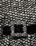Jupe plissée taille haute en tweed noir et blanc de Dolce & Gabbana, élégante et sophistiquée.