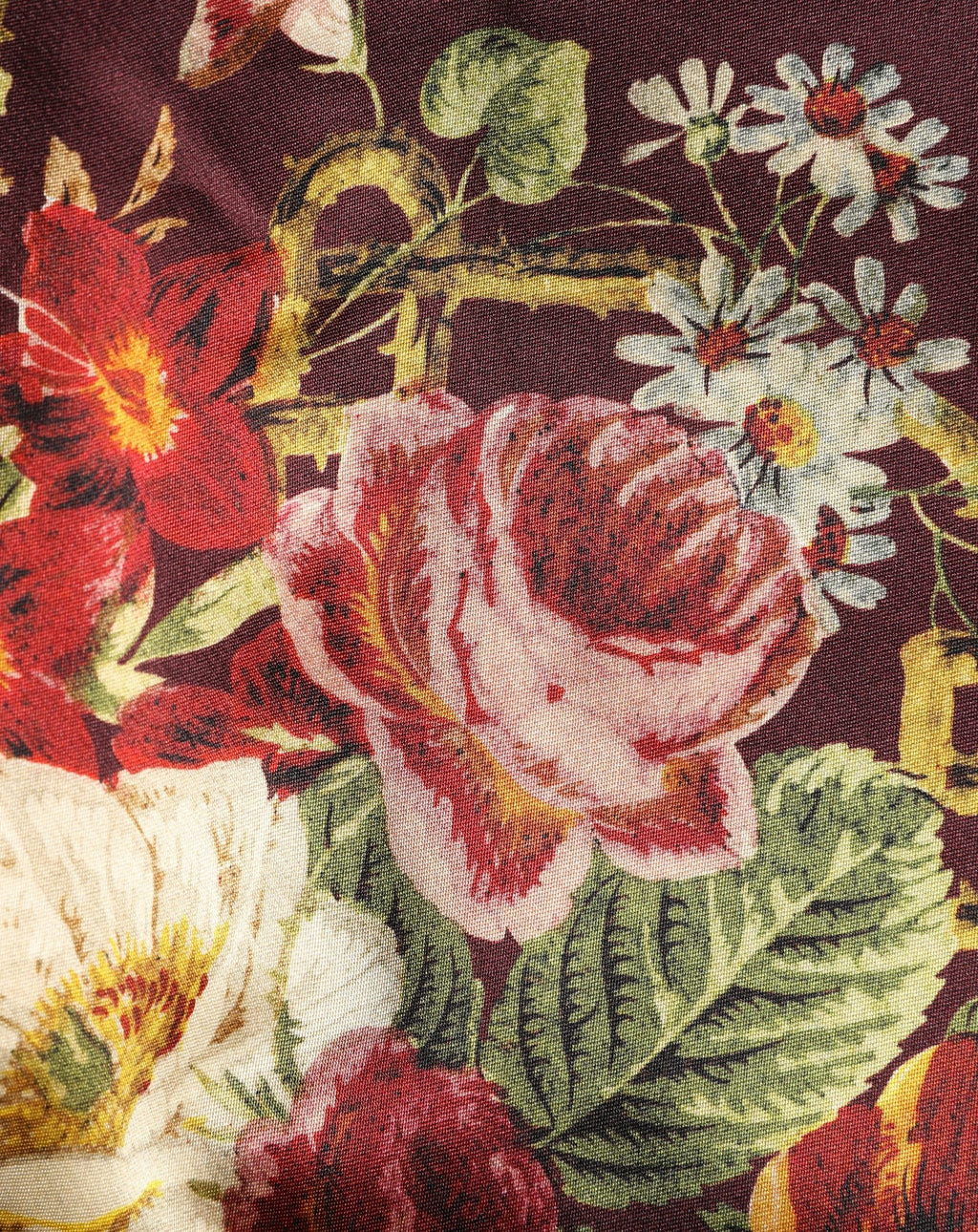 Jupe courte à taille haute Dolce & Gabbana, motif floral bordeaux, coupe A-line, style élégant et tendance.