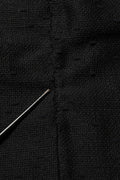 Jupe noire en coupe pencil à taille haute Dolce & Gabbana, longueur au genou, tissu élégant et ajusté.