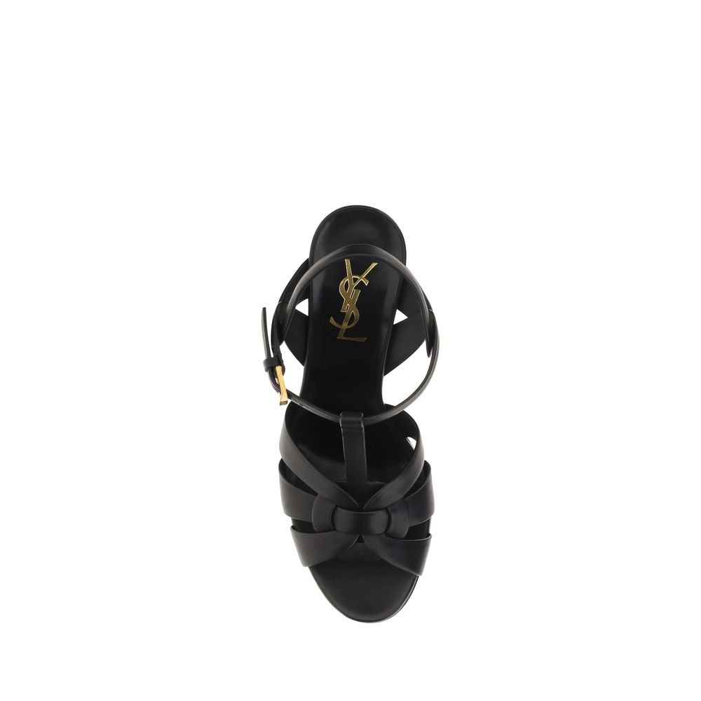 Sandales plates en cuir de veau noir Bos Taurus de Saint Laurent, style élégant et moderne.