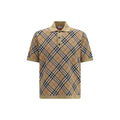 Chemise polo en coton beige Burberry avec col classique et logo brodé, vue de face.