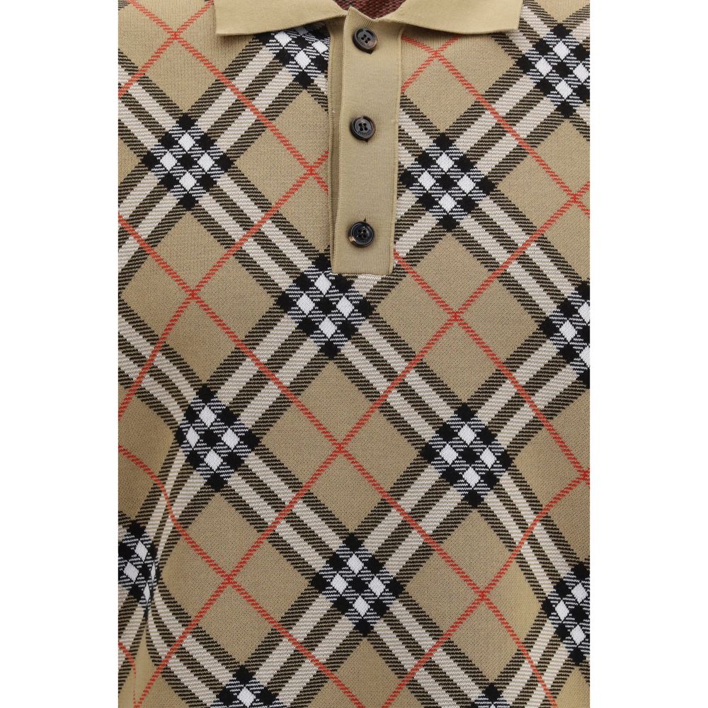 Polo en coton beige de la marque Burberry, manches courtes avec col classique, à porter pour un style élégant et décontracté.