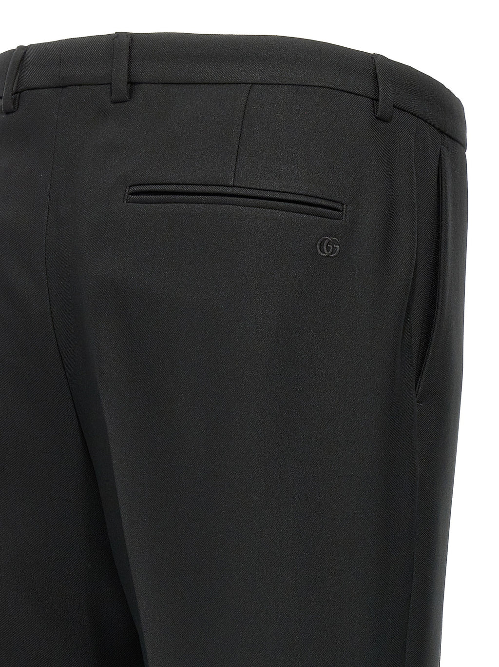 Pantalons décontractés en polyester noir de Gucci, coupe élégante et moderne, visibles en image.