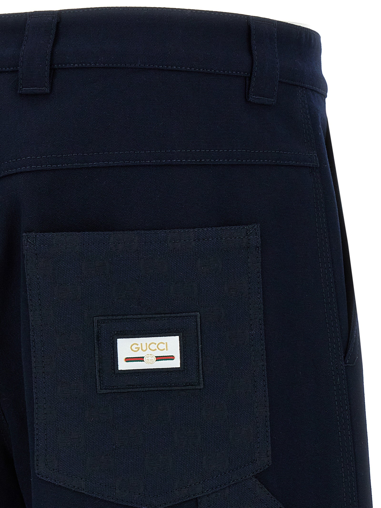 Pantalons décontractés en coton bleu de la marque Gucci, coupe confortable et style élégant pour un look casual.