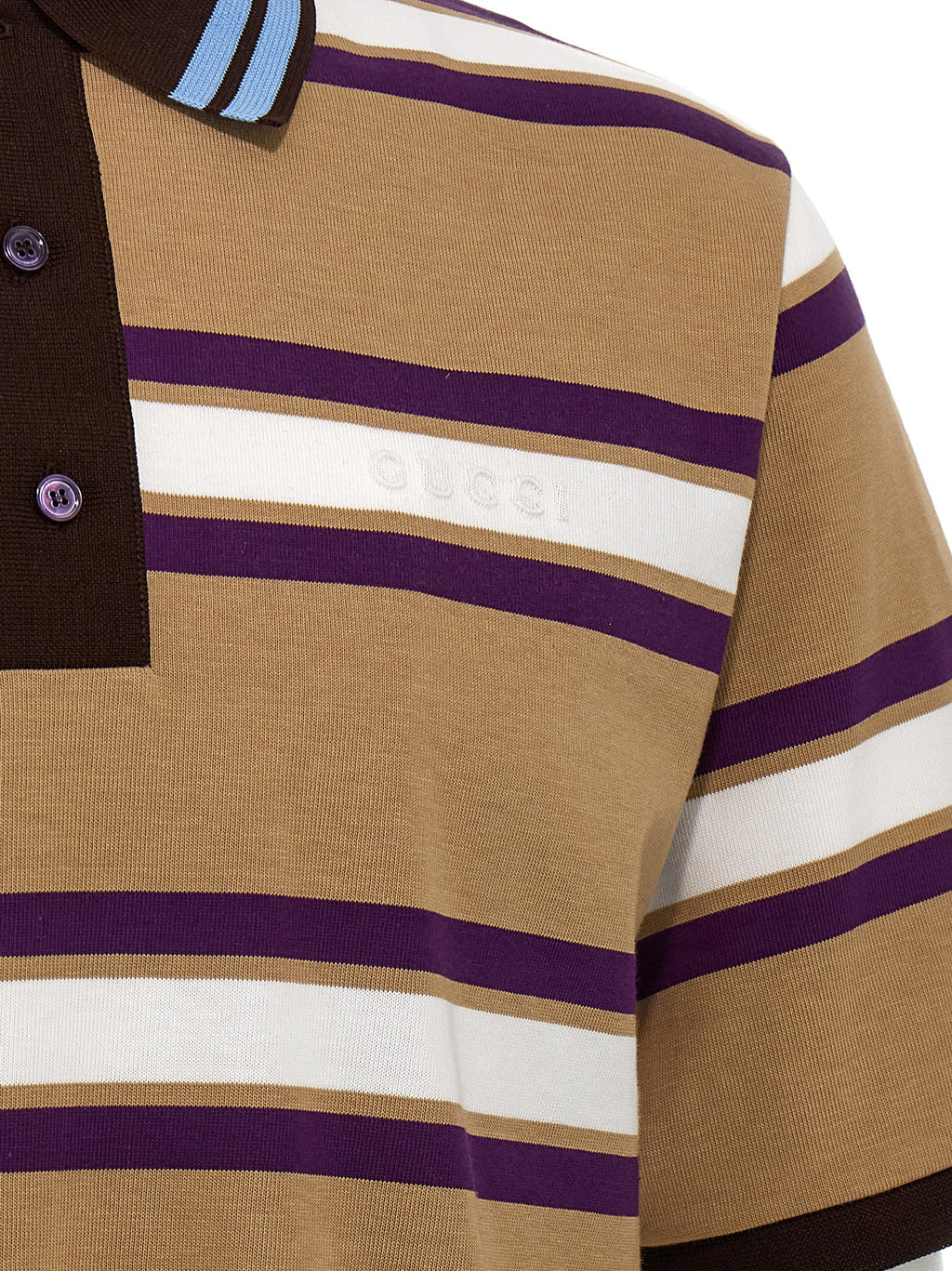 Chemise polo en coton multicolore Gucci, détail des couleurs vives et du logo Gucci sur la poitrine.