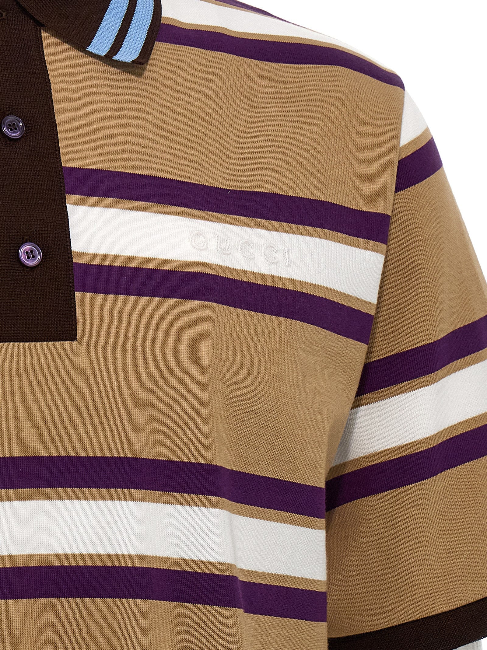Chemise polo en coton multicolore Gucci, détail des couleurs vives et du logo Gucci sur la poitrine.
