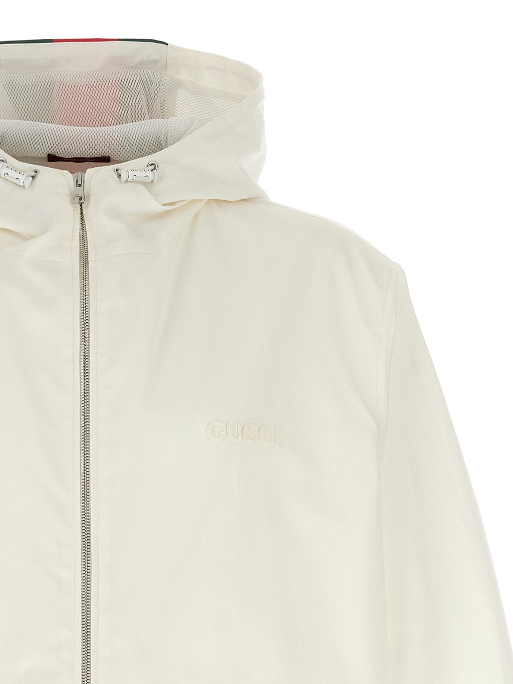 Veste en coton blanche Gucci pour hommes, coupe classique, avec détails de marque visibles sur la poitrine.