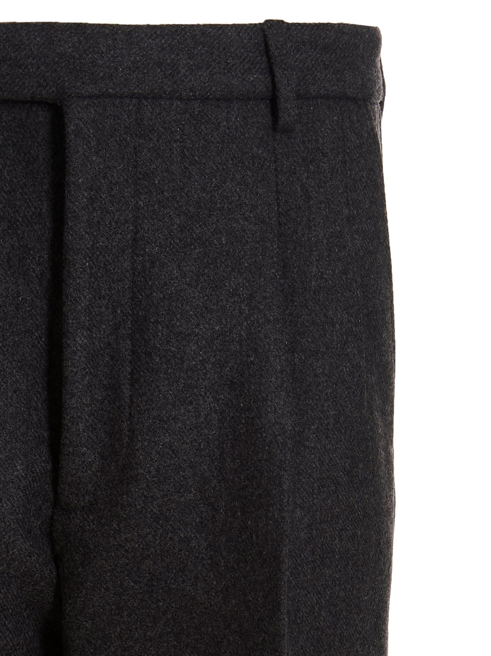 Pantalon gris en laine Gucci pour femme, coupe élégante et tissu de qualité, visible sur fond clair.