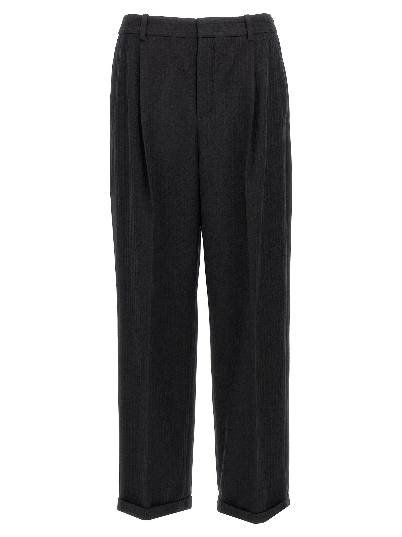Pantalon en laine noire pour femme de la marque Saint Laurent, coupe élégante et finition soignée, porté avec une chemise blanche.