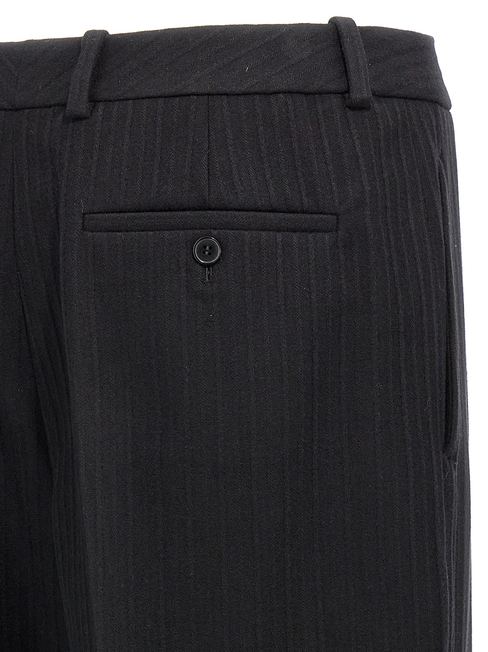 Pantalon en laine noir Saint Laurent pour femme, coupe élégante et classique, visible dans l'image.