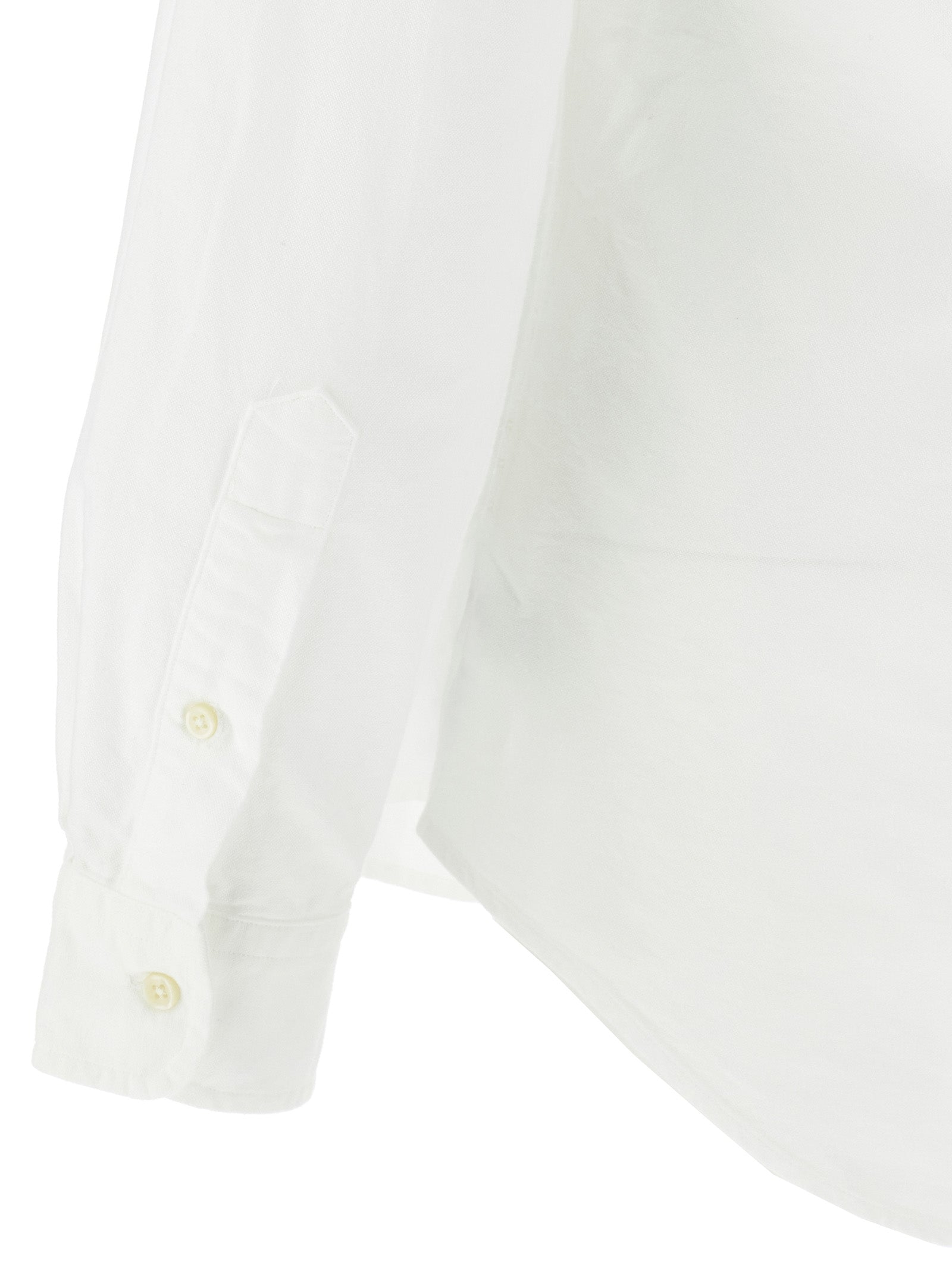 Blouse en coton blanc Polo Ralph Lauren avec col classique et manches longues, portée sur un mannequin.