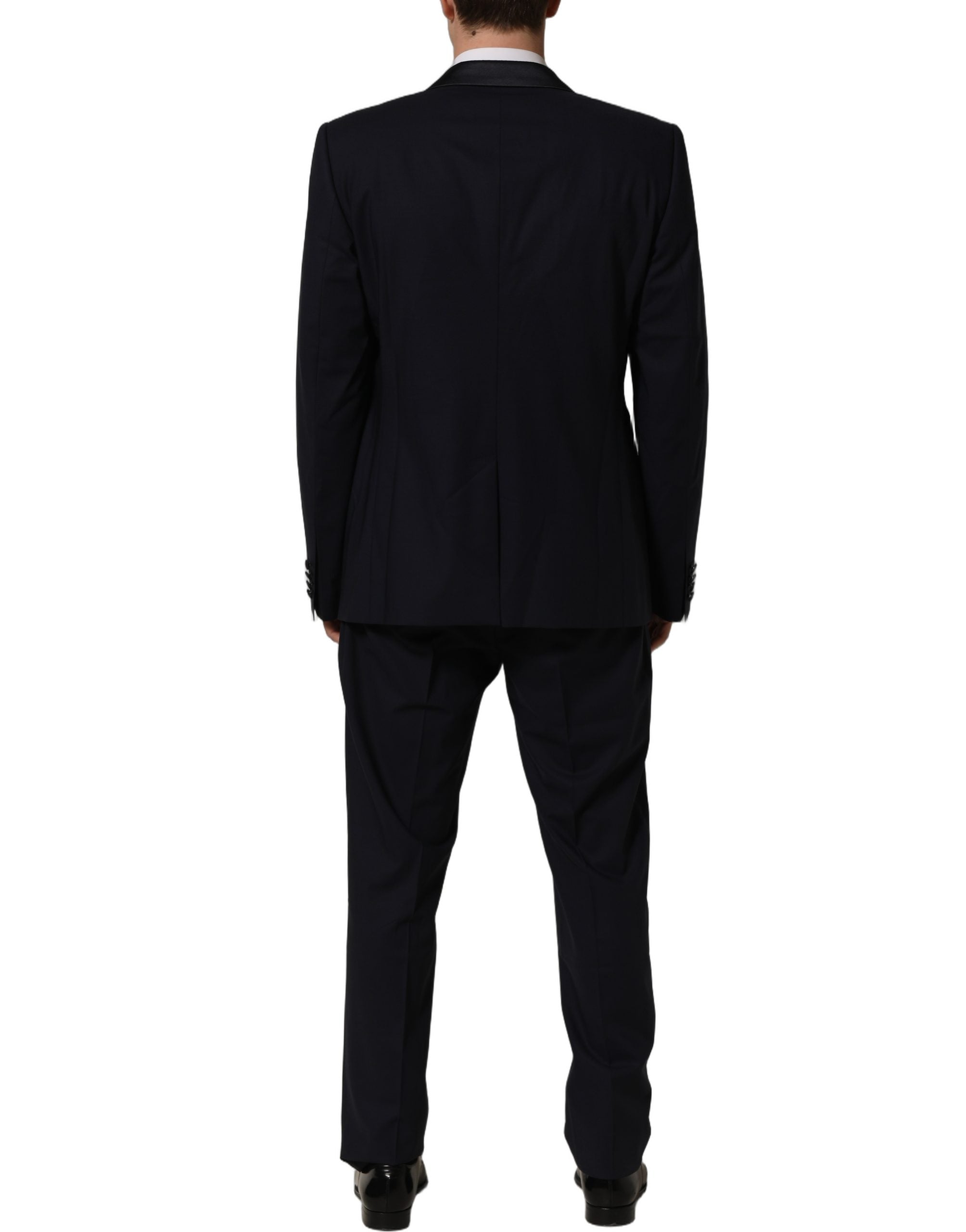 Costume homme bleu foncé Dolce & Gabbana à deux pièces, veste à double boutonnage et pantalon assorti, élégance masculine.