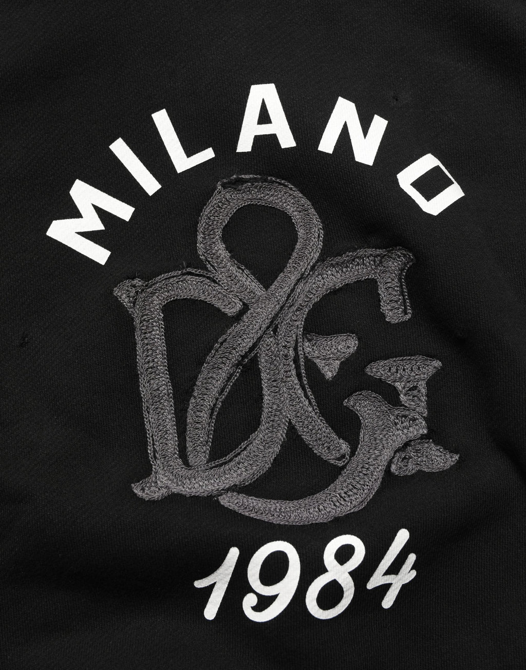 Sweat à capuche noir Dolce & Gabbana en coton avec impression Milano1984, style décontracté et logo visible.