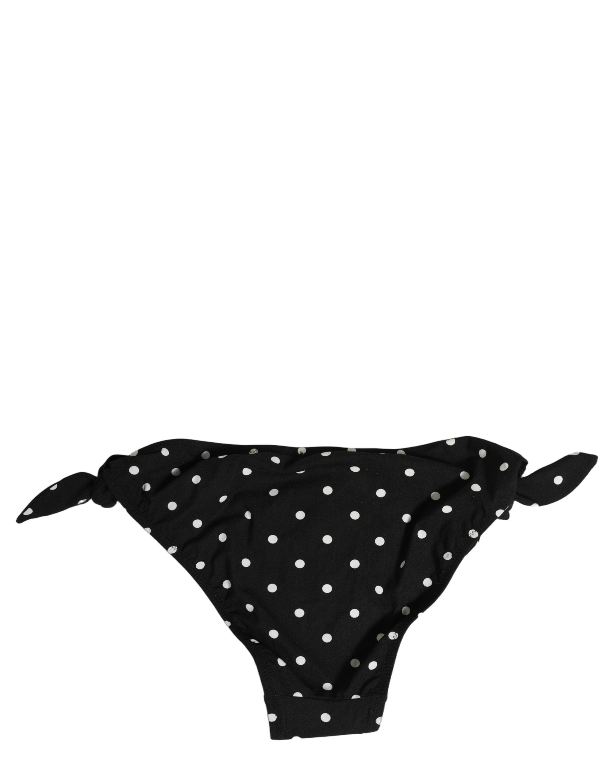 Bas de maillot de bain Dolce & Gabbana à pois noirs, vêtement de plage élégant pour femme, vue de face.