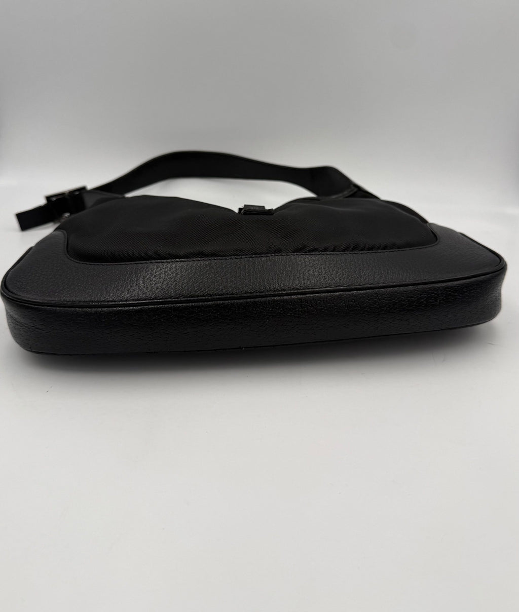 Sac à main Gucci Jackie en cuir et toile, élégant avec détails sophistiqués, pour un style chic et intemporel.