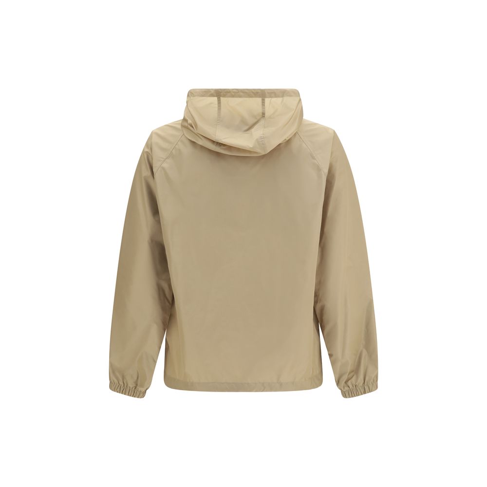 Veste en nylon beige Burberry pour femme, coupe légère et élégante, avec détails de marque visibles.