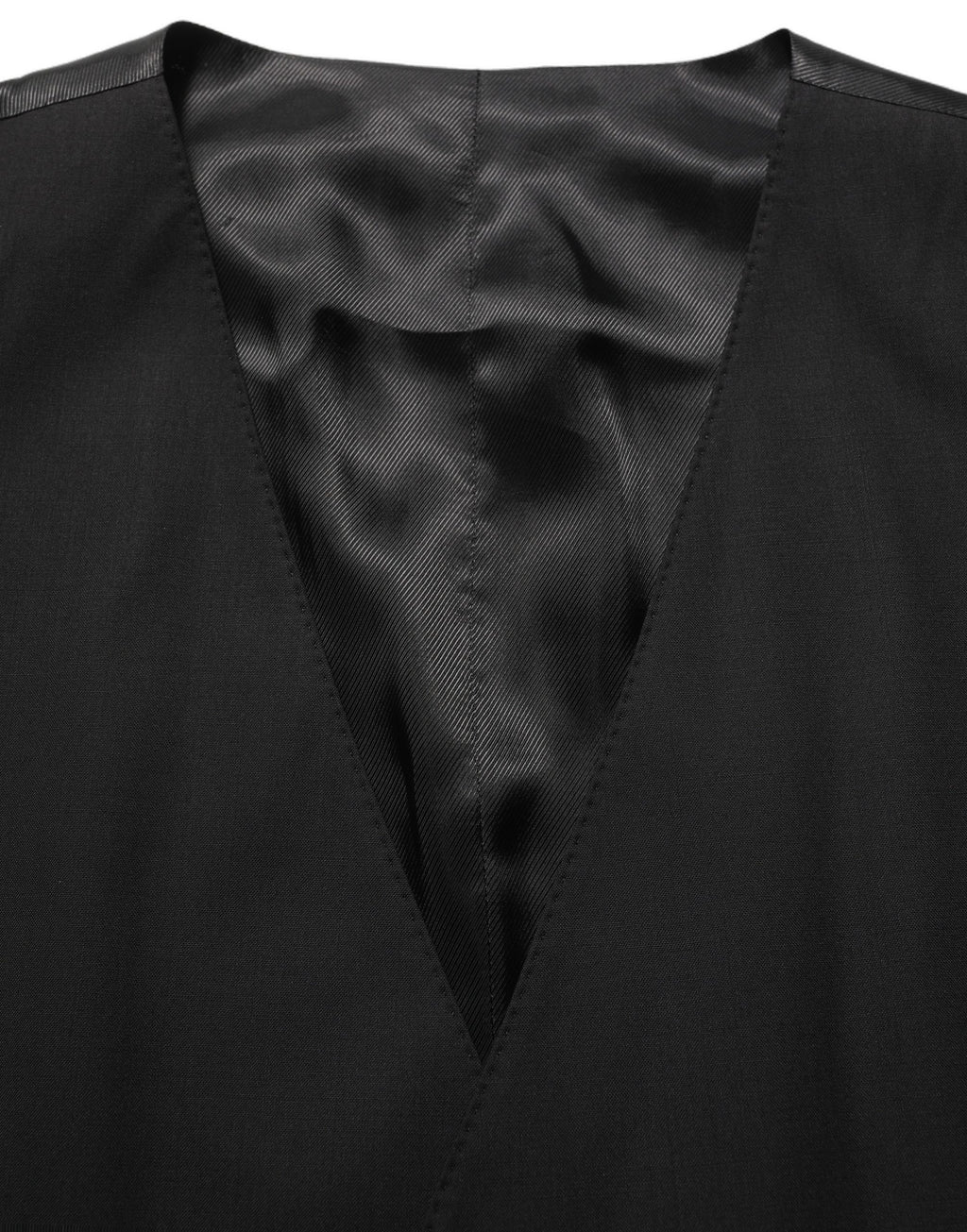 Gilet formel en laine noire Dolce & Gabbana avec taille extensible, porté de manière élégante sur un mannequin.